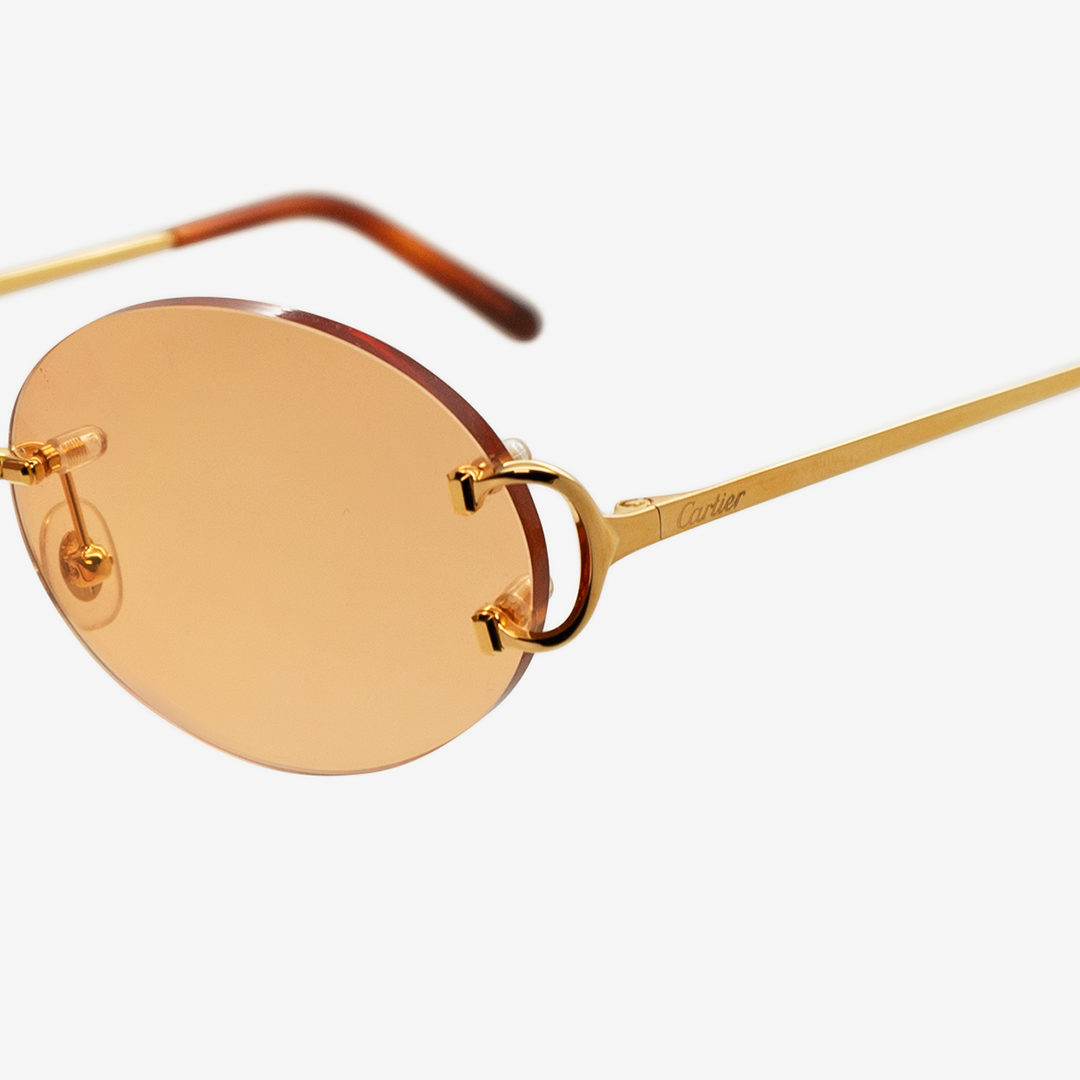 Cartier gold oval glasses best sale